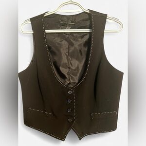 Black vest with contrast white stitching and button front.